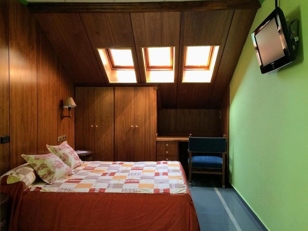Postel nebo postele na pokoji v ubytování Real Hotel