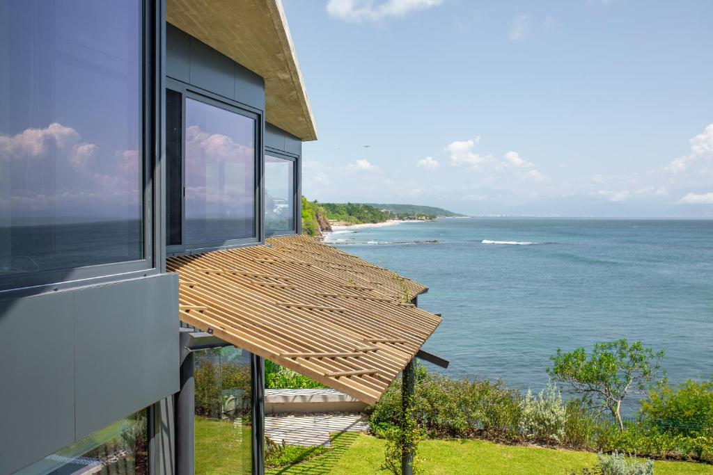 a balcony of a house with a view of the ocean at Casa Borrega, Luxury and Design in Higuera Blanca
