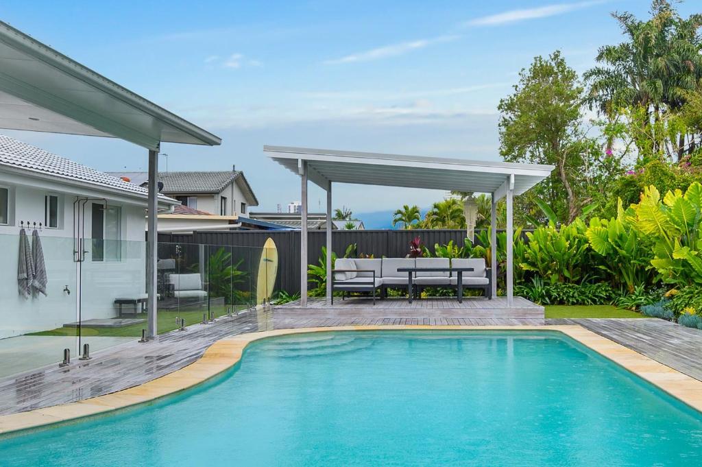 a swimming pool in the backyard of a house at Aloka By Khove in Gold Coast