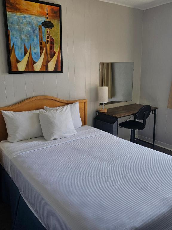 Postel nebo postele na pokoji v ubytování 2400 Motel