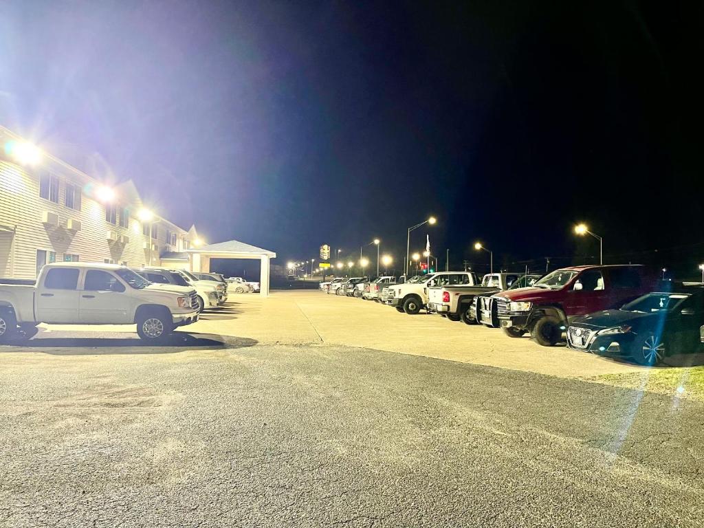 a parking lot with a bunch of cars parked at Hunter Lodge in Ripley
