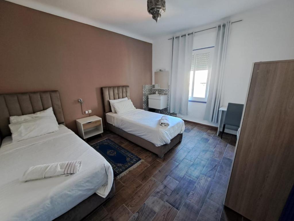 Postel nebo postele na pokoji v ubytování El Muniria