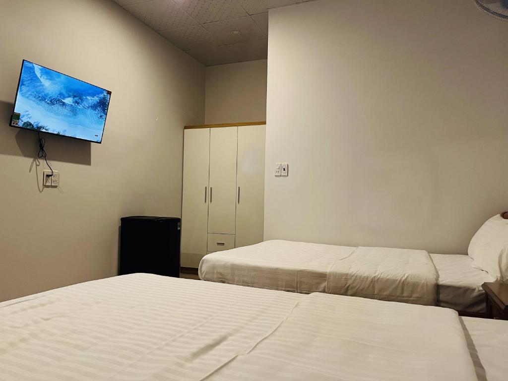 Postel nebo postele na pokoji v ubytování Bình Minh Homestay - Dốc Lết