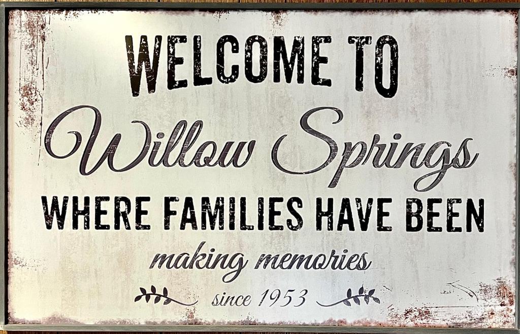 a sign that says welcome to willow springs where families have been making memories at Willow Springs Resort in Bridgeport