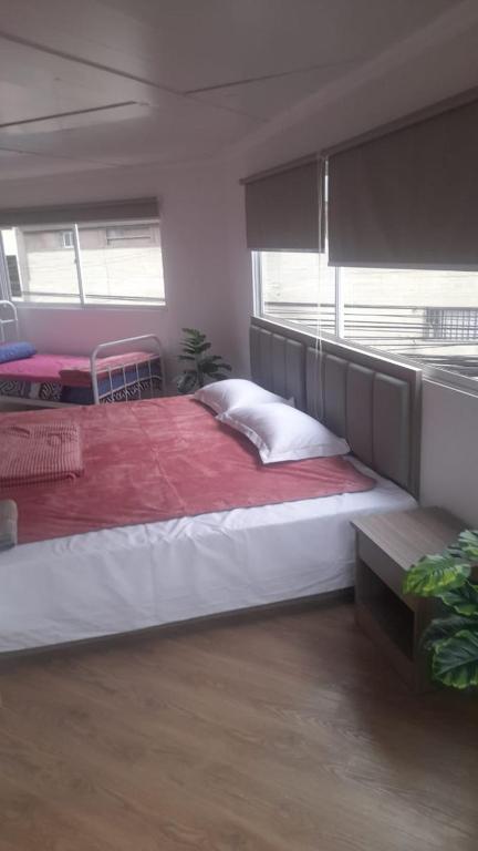 מיטה או מיטות בחדר ב-NLM HOTEL