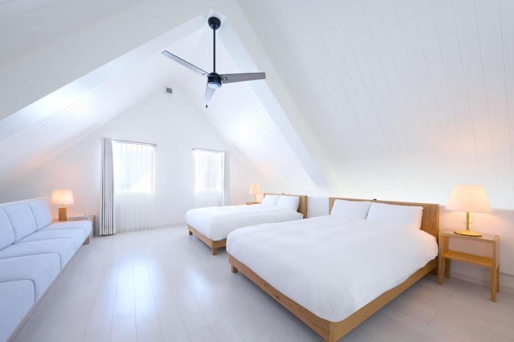 Postel nebo postele na pokoji v ubytování Pricia Resort Yoron