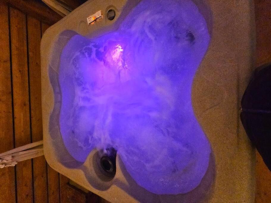 a purple toilet bowl with a purple substance at Matchbox desert oasis hot tub, pet friendly! in Las Cruces