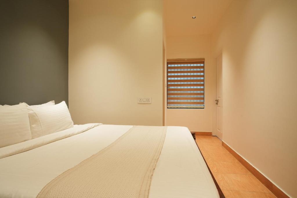 Postel nebo postele na pokoji v ubytování Rasha residency