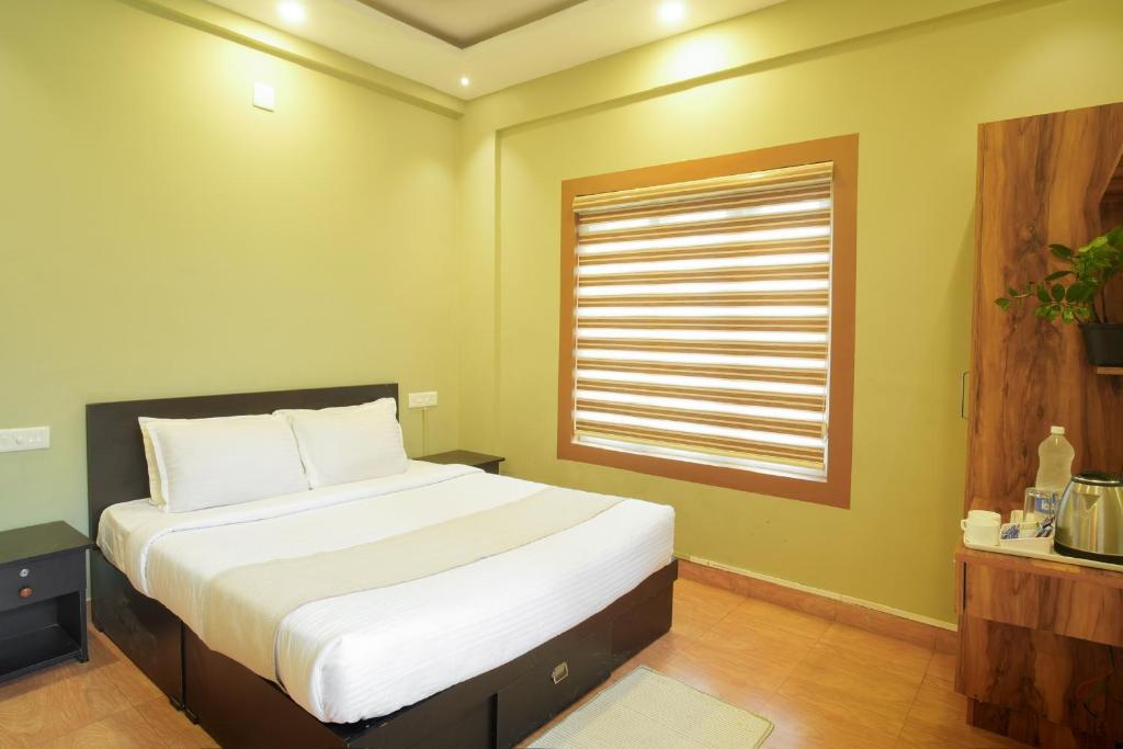 Postel nebo postele na pokoji v ubytování Rasha residency
