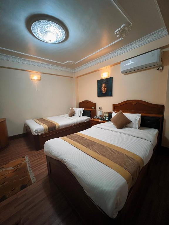Postel nebo postele na pokoji v ubytování Hotel Bodhiz