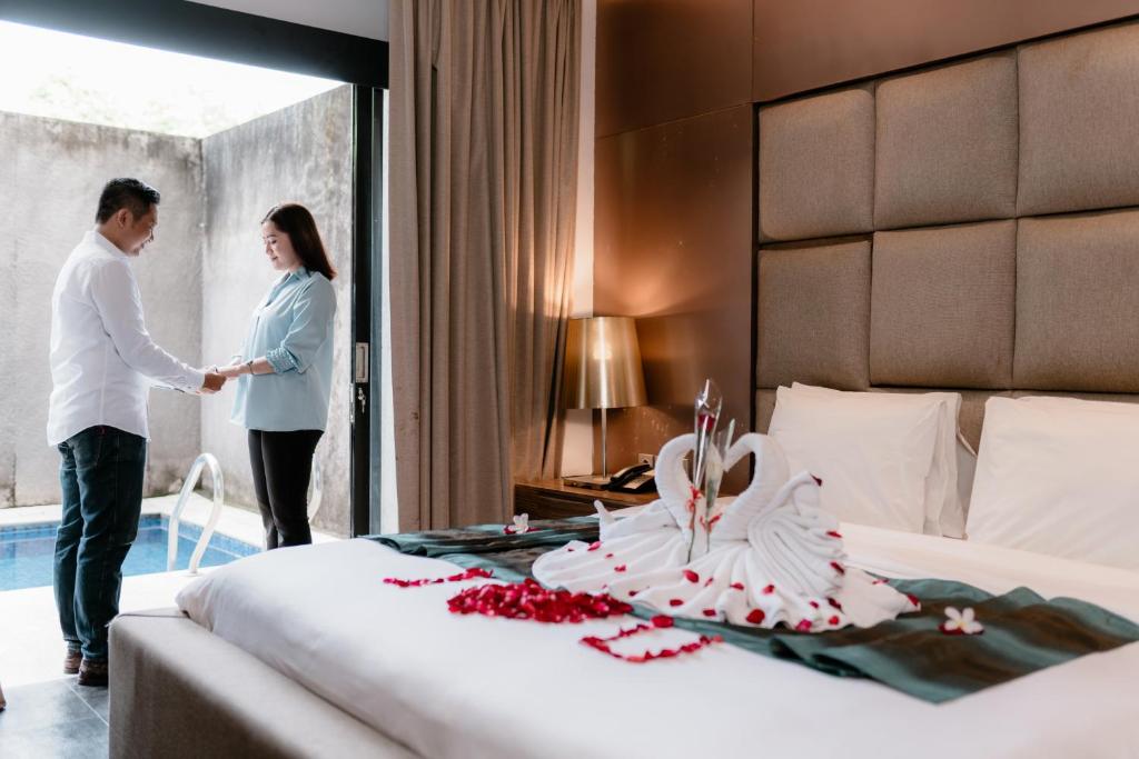 Postel nebo postele na pokoji v ubytování Amaroossa Suite Bali