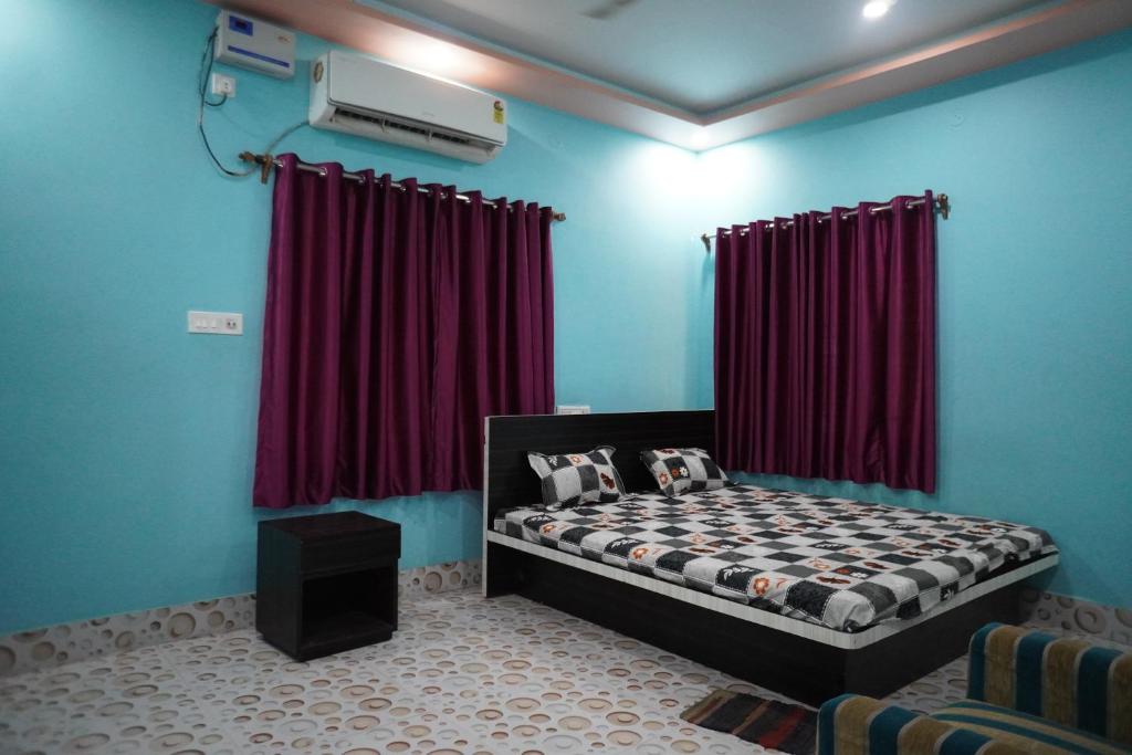 En eller flere senger på et rom på Hotel Bidisha 2