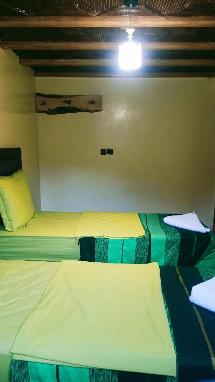 Postel nebo postele na pokoji v ubytování Atlas Chalet Armed