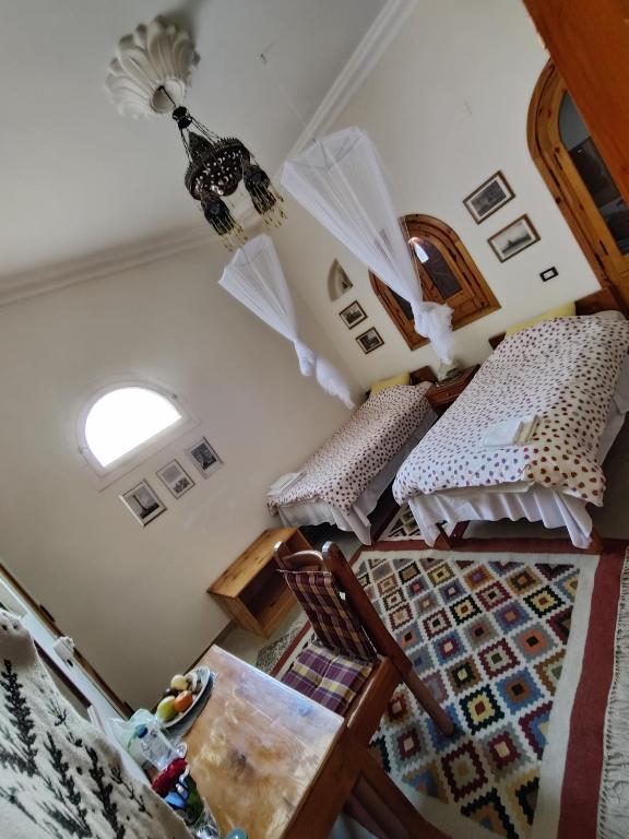 Postel nebo postele na pokoji v ubytování Alexander Lodge