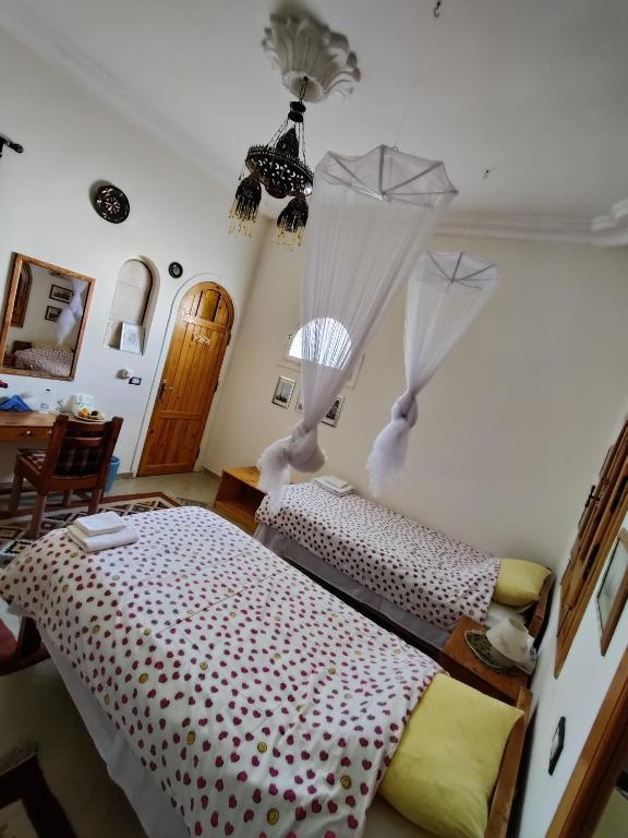 Postel nebo postele na pokoji v ubytování Alexander Lodge