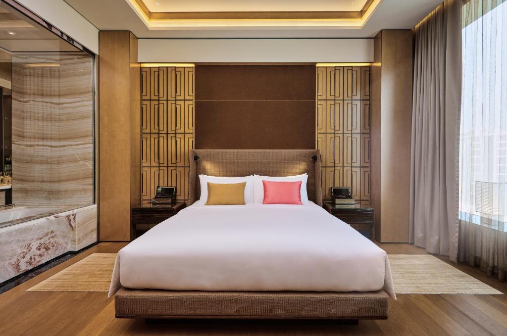 Postel nebo postele na pokoji v ubytování MGM Cotai