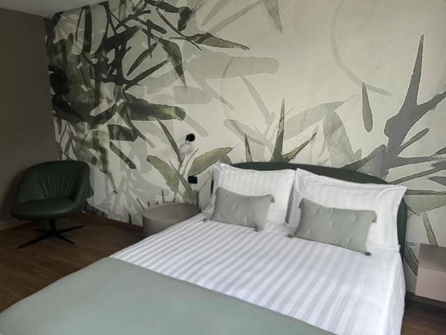 Postel nebo postele na pokoji v ubytování Piccolo Hotel