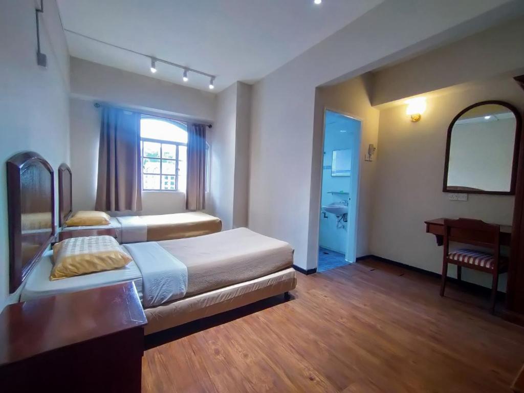 Postel nebo postele na pokoji v ubytování The Little Star Studio Hotel- Star Regency