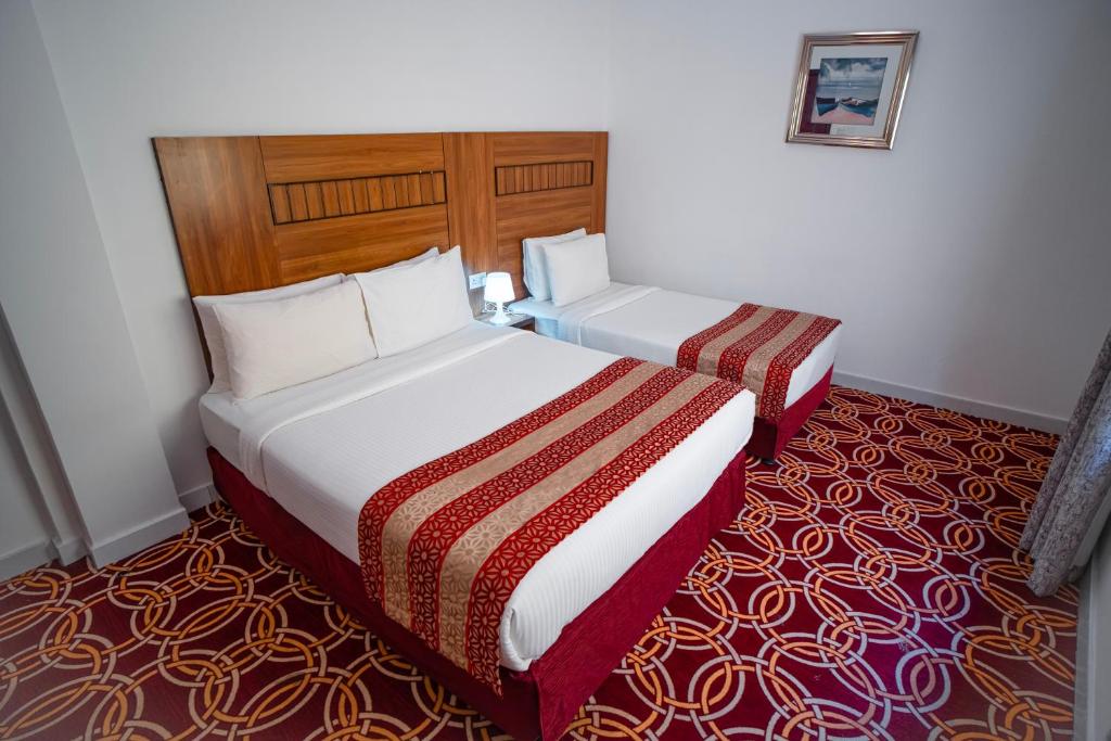 Postel nebo postele na pokoji v ubytování AL KARNAK HOTEL - BRANCH