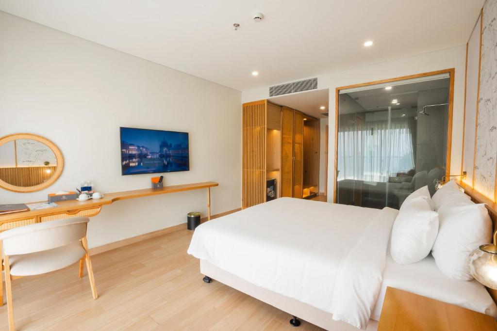 Postel nebo postele na pokoji v ubytování Seabird Hotel Thien Cam