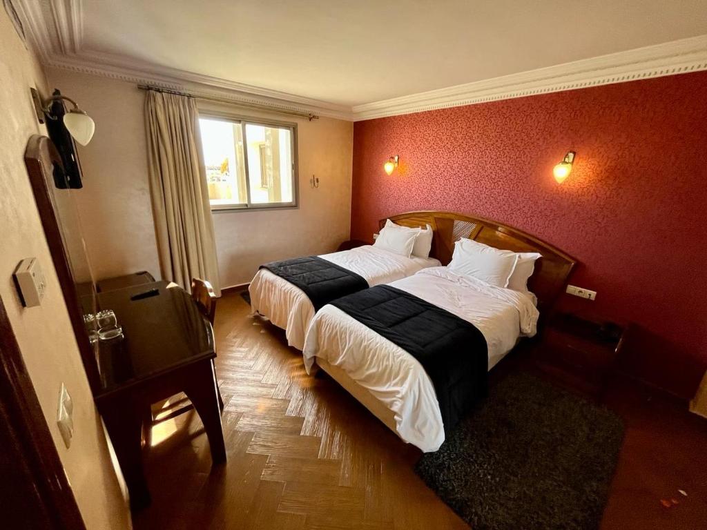 Postel nebo postele na pokoji v ubytování Hotel Malta