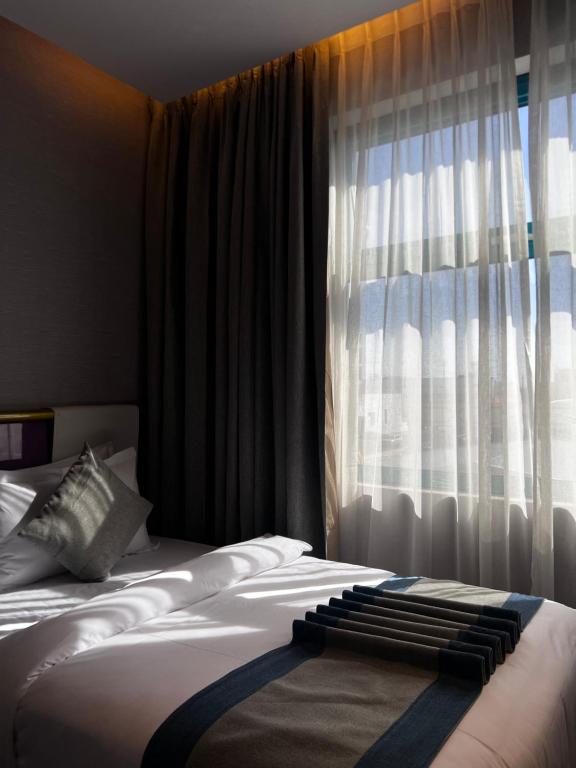 Postel nebo postele na pokoji v ubytování Marvelous Hotel