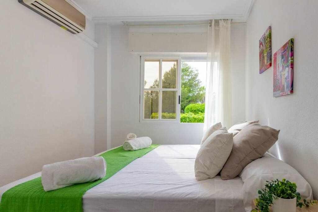 Posteľ alebo postele v izbe v ubytovaní Apartamento Pink Summer