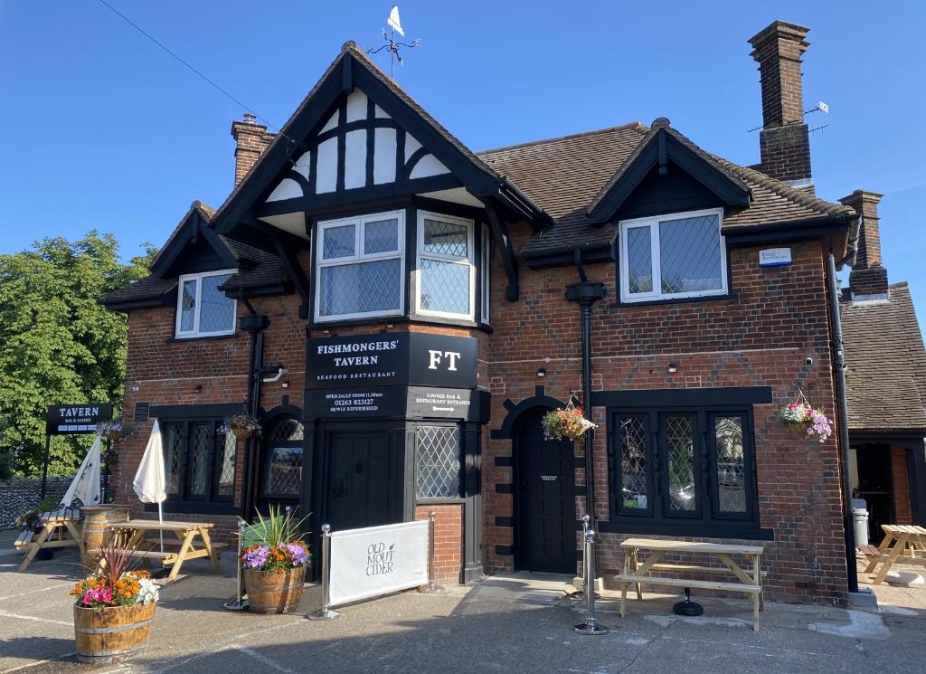 a store front of a brick building at The Fishmongers Tavern in Sheringham
