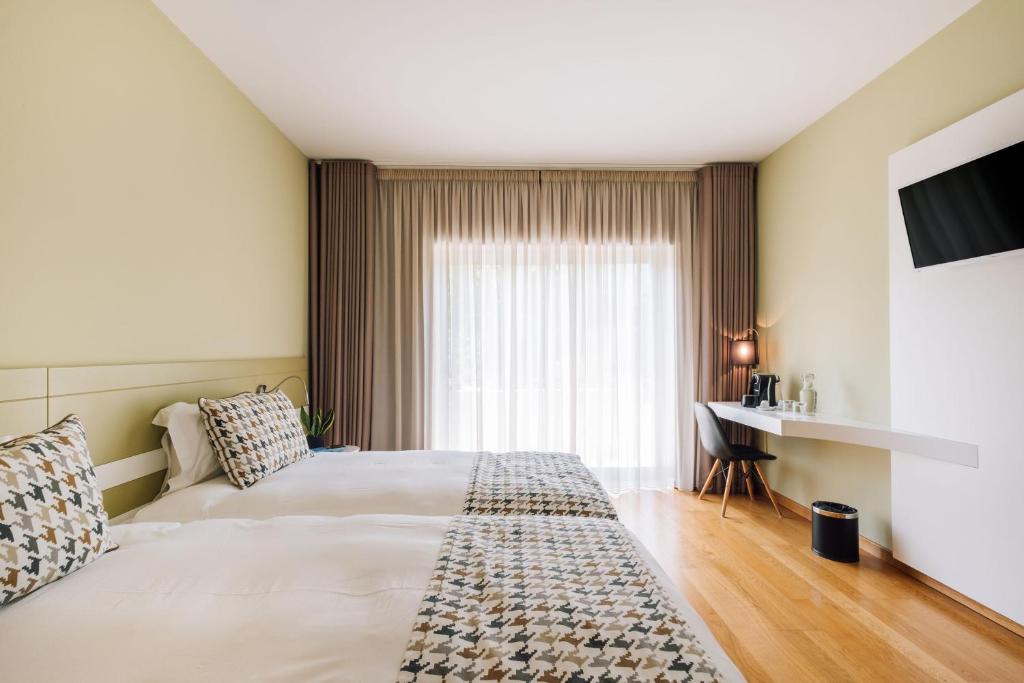Postel nebo postele na pokoji v ubytování Alva Valley Hotel