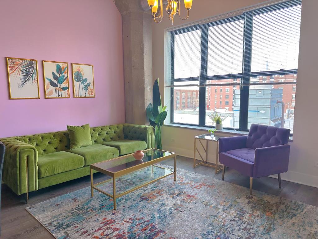 a living room with a green couch and a purple chair at McCormick Place Skyline view 2br-2ba with Optional parking for 6 guests in Chicago