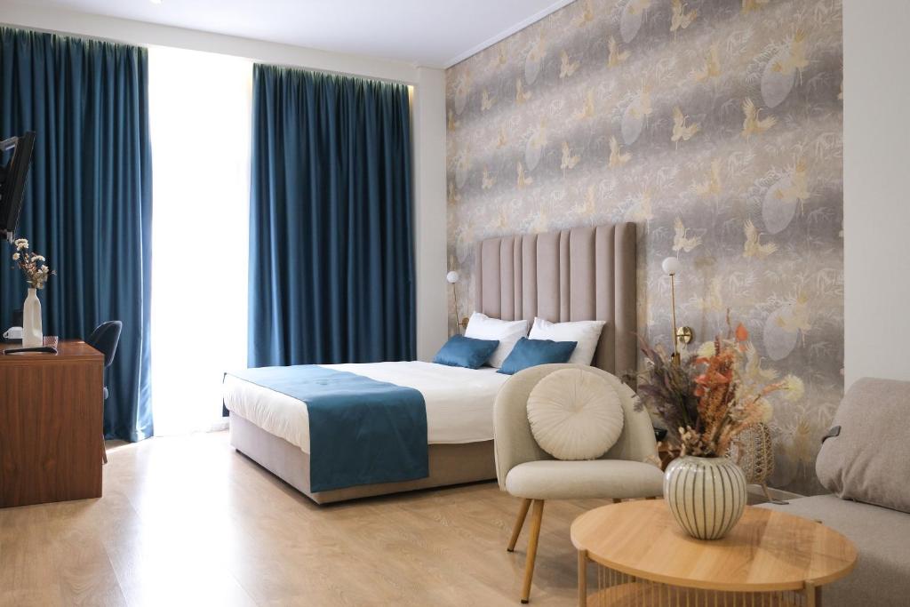 Postel nebo postele na pokoji v ubytování Golden City Hotel , Tirana