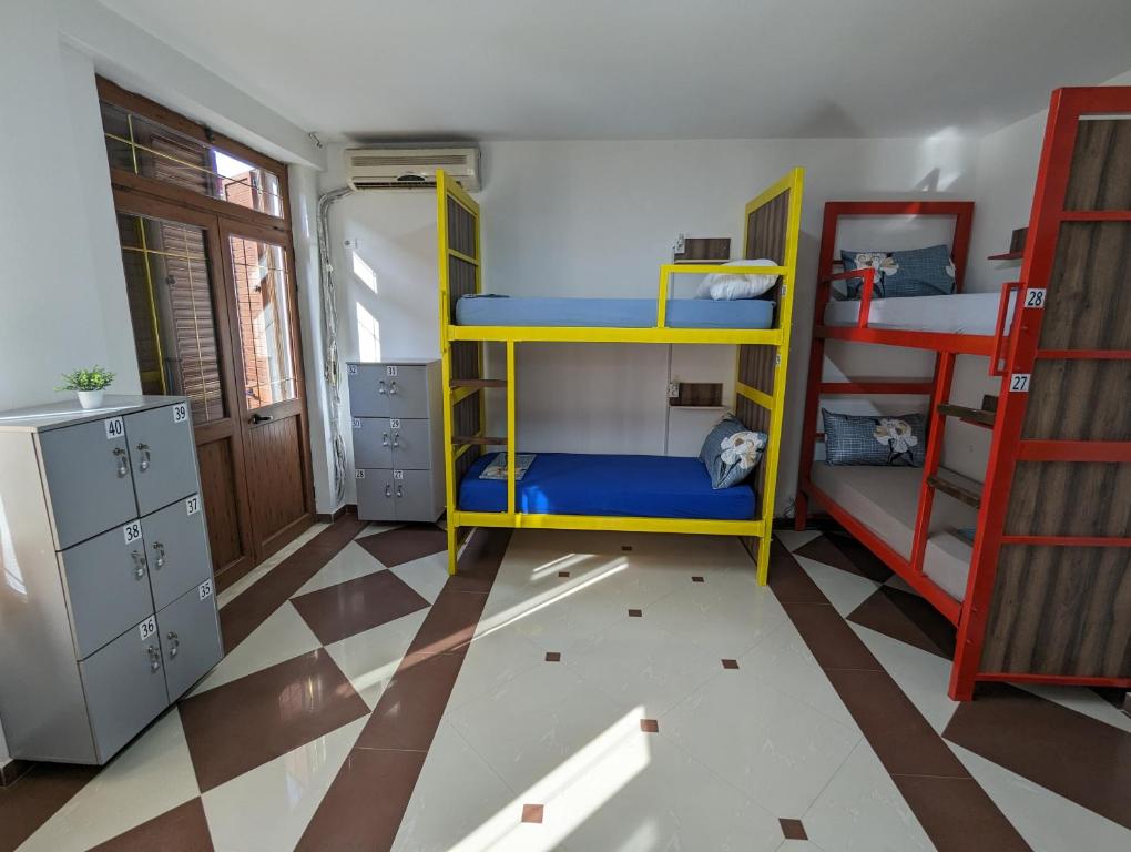Ein Bett oder Betten in einem Zimmer der Unterkunft Tias Hostel