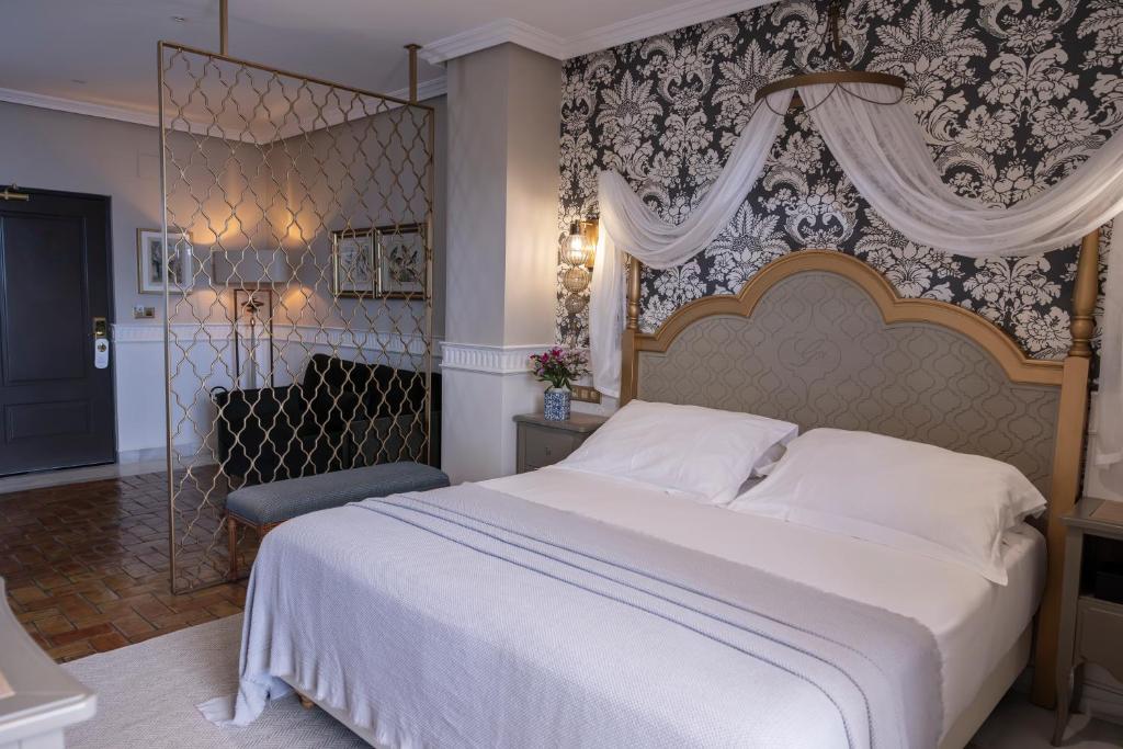 Postel nebo postele na pokoji v ubytování Hotel Gravina 51