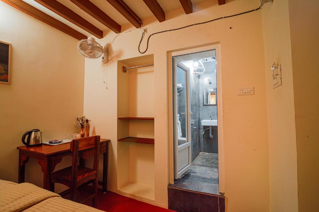 Postel nebo postele na pokoji v ubytování Parambara Heritage