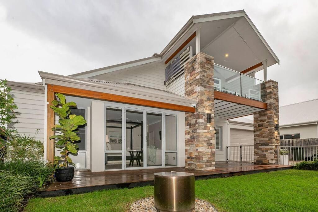 a house with large windows and a balcony at The Bay Retreat in Dunsborough