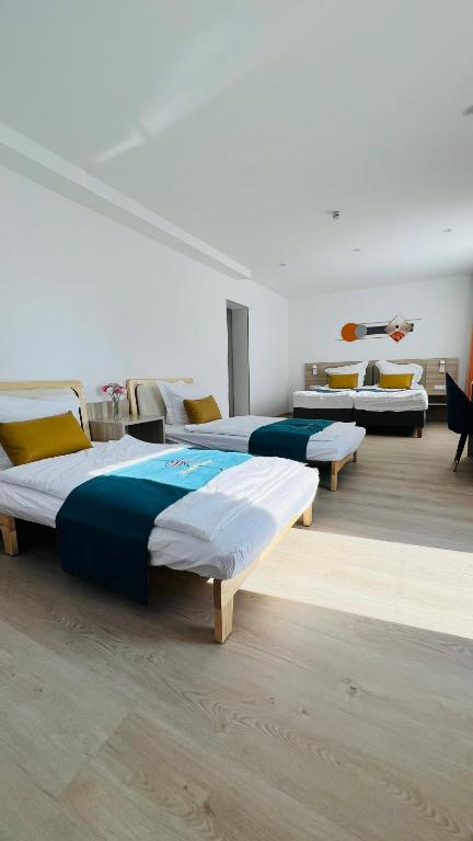 Postel nebo postele na pokoji v ubytování Hotel Libers