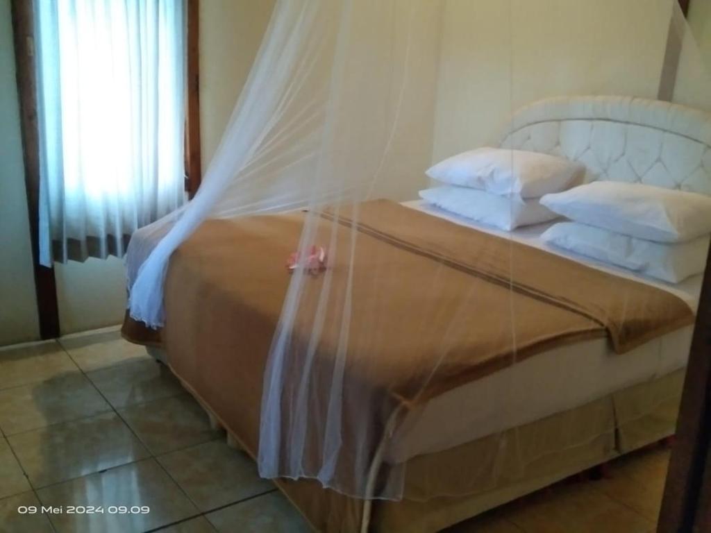Posteľ alebo postele v izbe v ubytovaní Kura Kura Villas