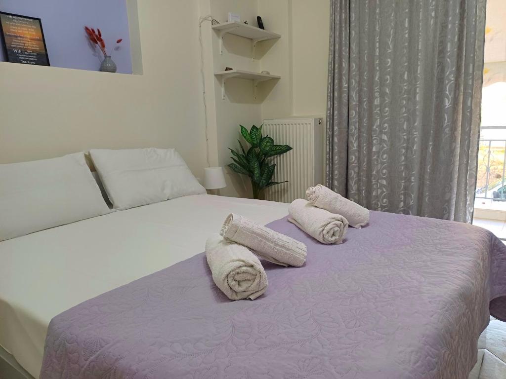 Posteľ alebo postele v izbe v ubytovaní Lefkada SunCentral Apartments