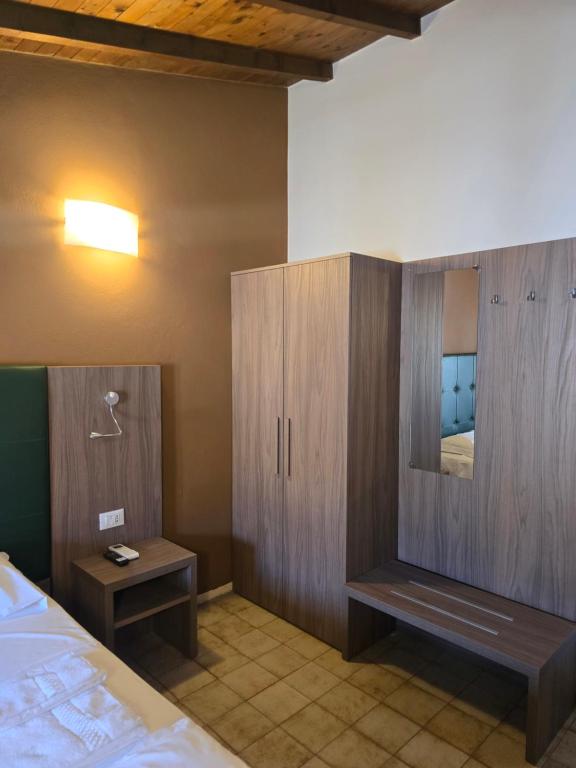 Postel nebo postele na pokoji v ubytování Albergo Al Gambero