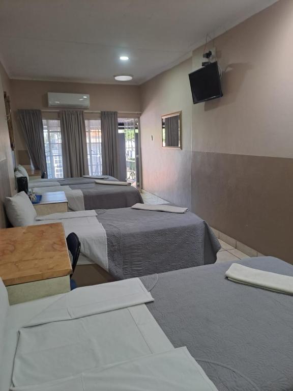 Postel nebo postele na pokoji v ubytování Sleep 'n Go Guesthouse