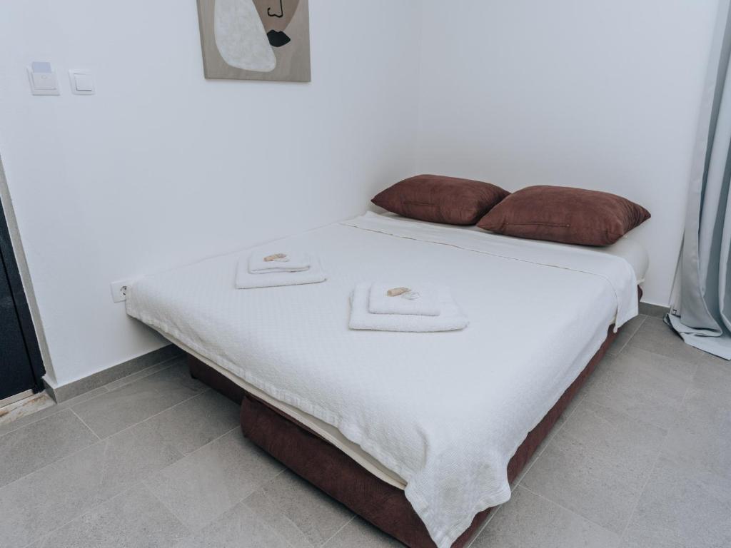 Postel nebo postele na pokoji v ubytování Apartments Milivojevic