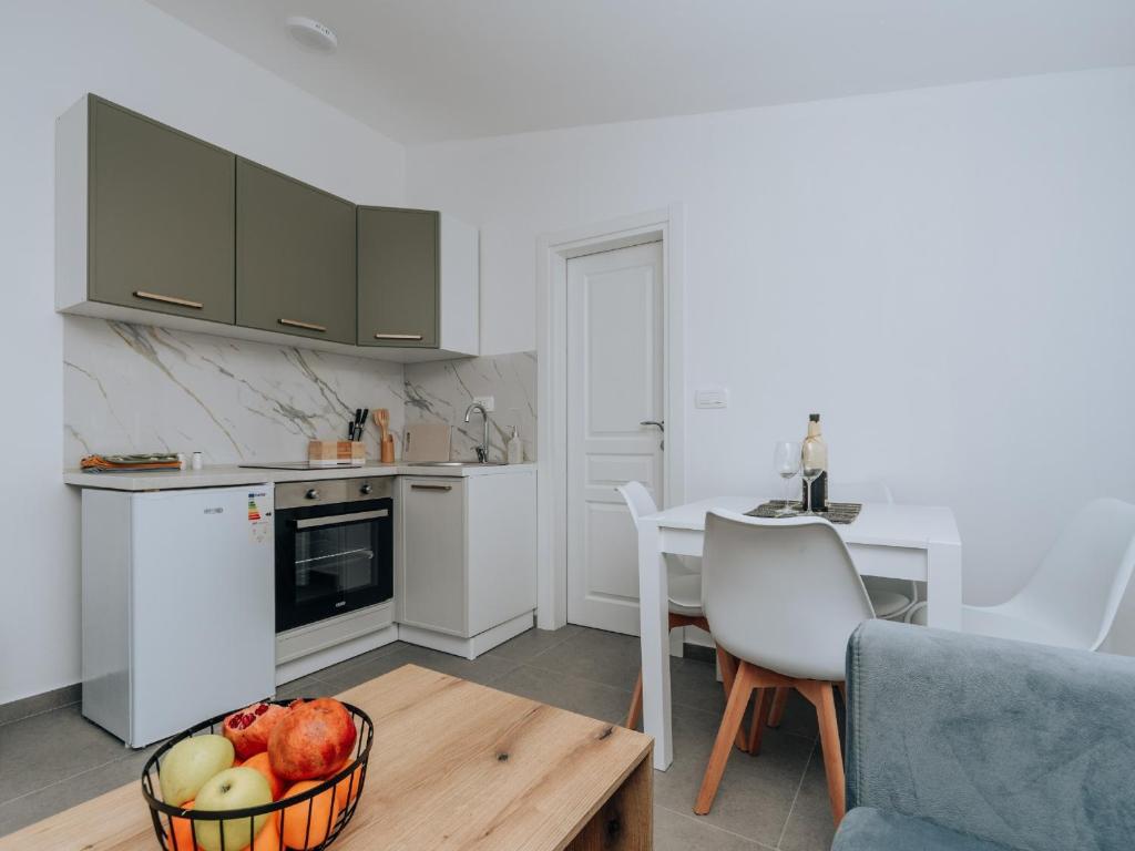 Kuchyň nebo kuchyňský kout v ubytování Apartments Milivojevic