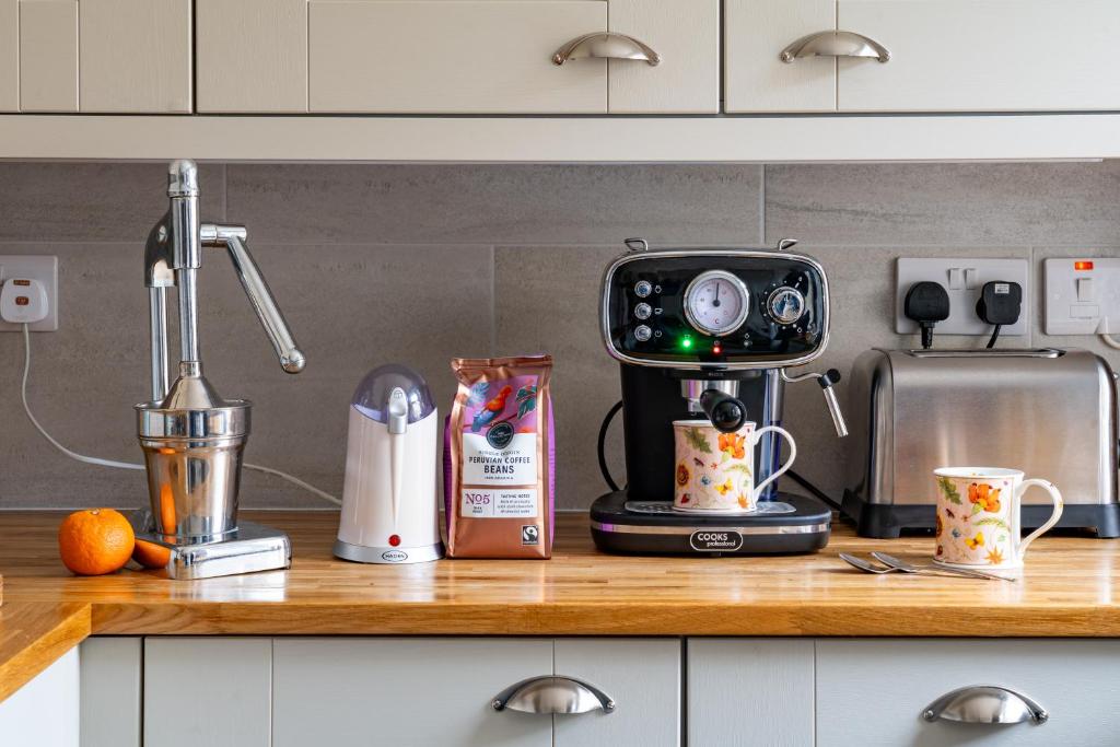 a kitchen counter with a mixer on a counter top at CRAVEN VUE - SKIPTON in Skipton