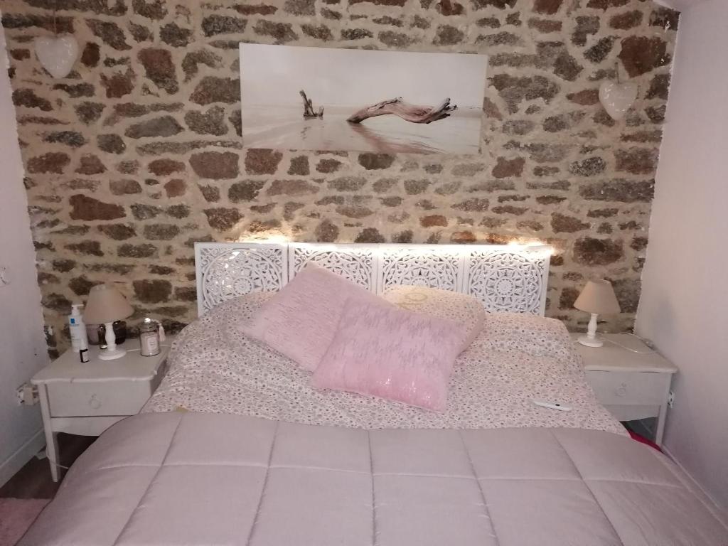 Postel nebo postele na pokoji v ubytování Maison
