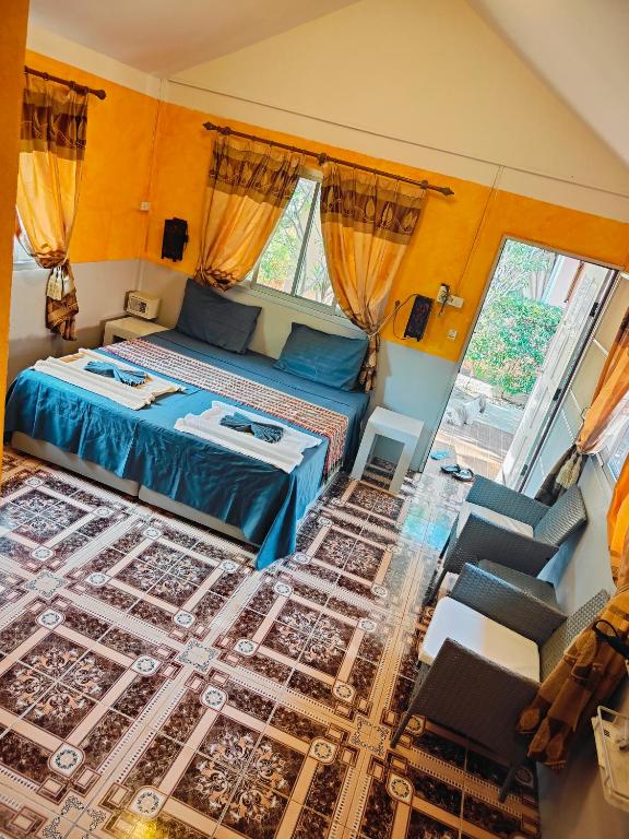Postel nebo postele na pokoji v ubytování Ban Elephant Blanc Bungalow