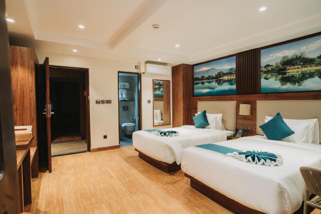 Postel nebo postele na pokoji v ubytování Dees Boutique Hotel