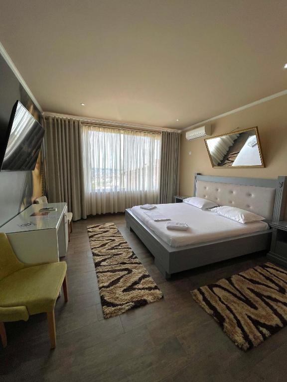 Postel nebo postele na pokoji v ubytování Imperium Hotel