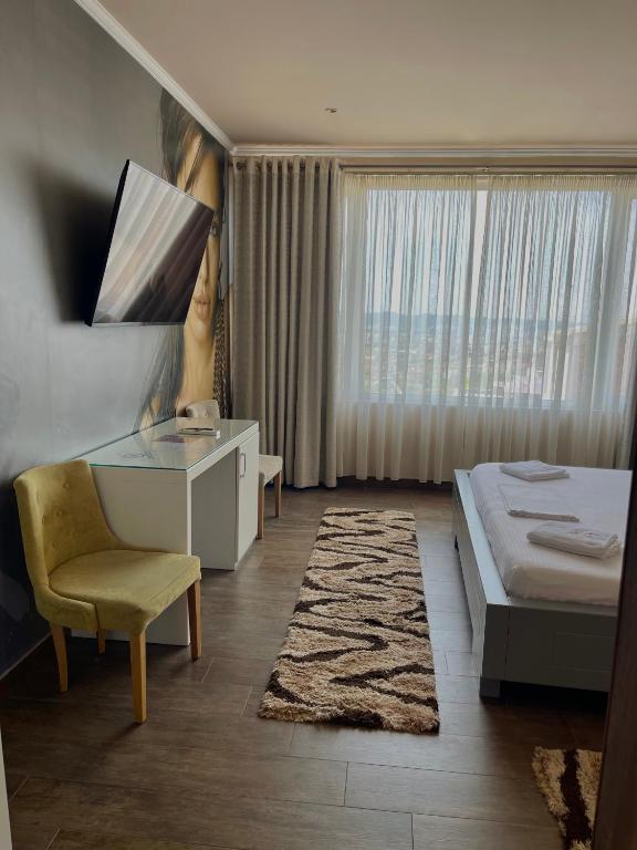Postel nebo postele na pokoji v ubytování Imperium Hotel