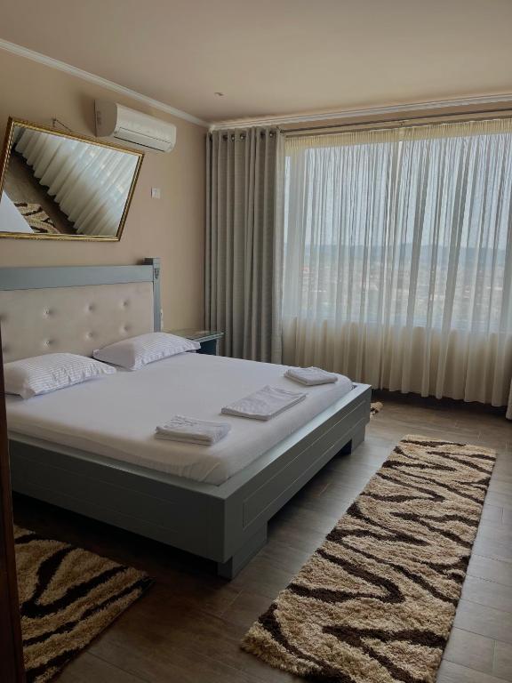 Postel nebo postele na pokoji v ubytování Imperium Hotel