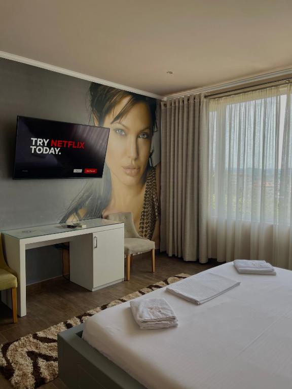 Postel nebo postele na pokoji v ubytování Imperium Hotel